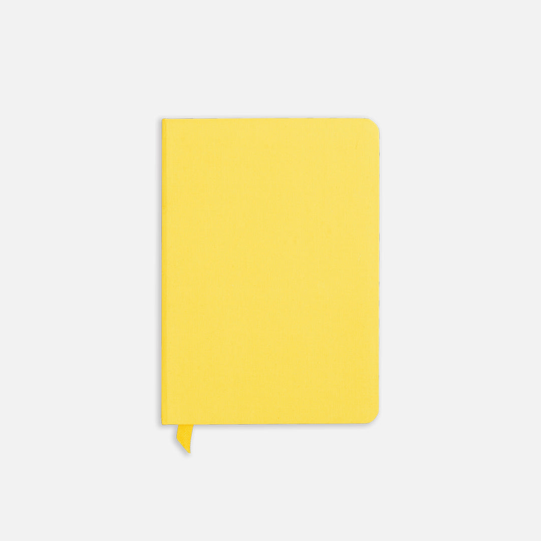 Yellowgold Confidant Hardcover Notebook with a yellow ribbon.