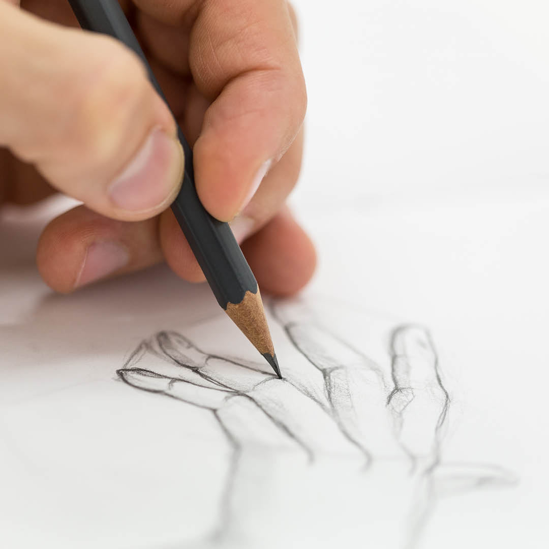 Pencil being used to draw.