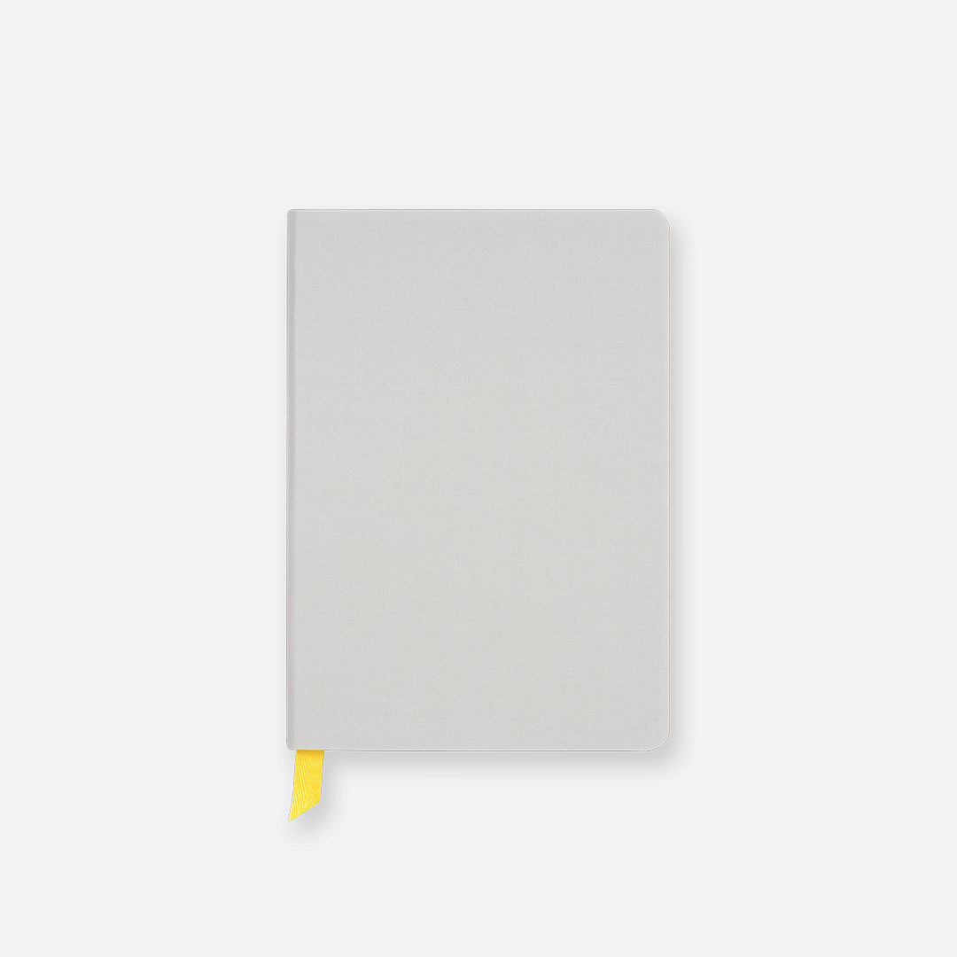 Light Gray Confidant Hardcover Notebook with a yellow ribbon.
