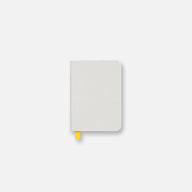 Pocket size light gray confidant hardcover notebook with yellow ribbon.